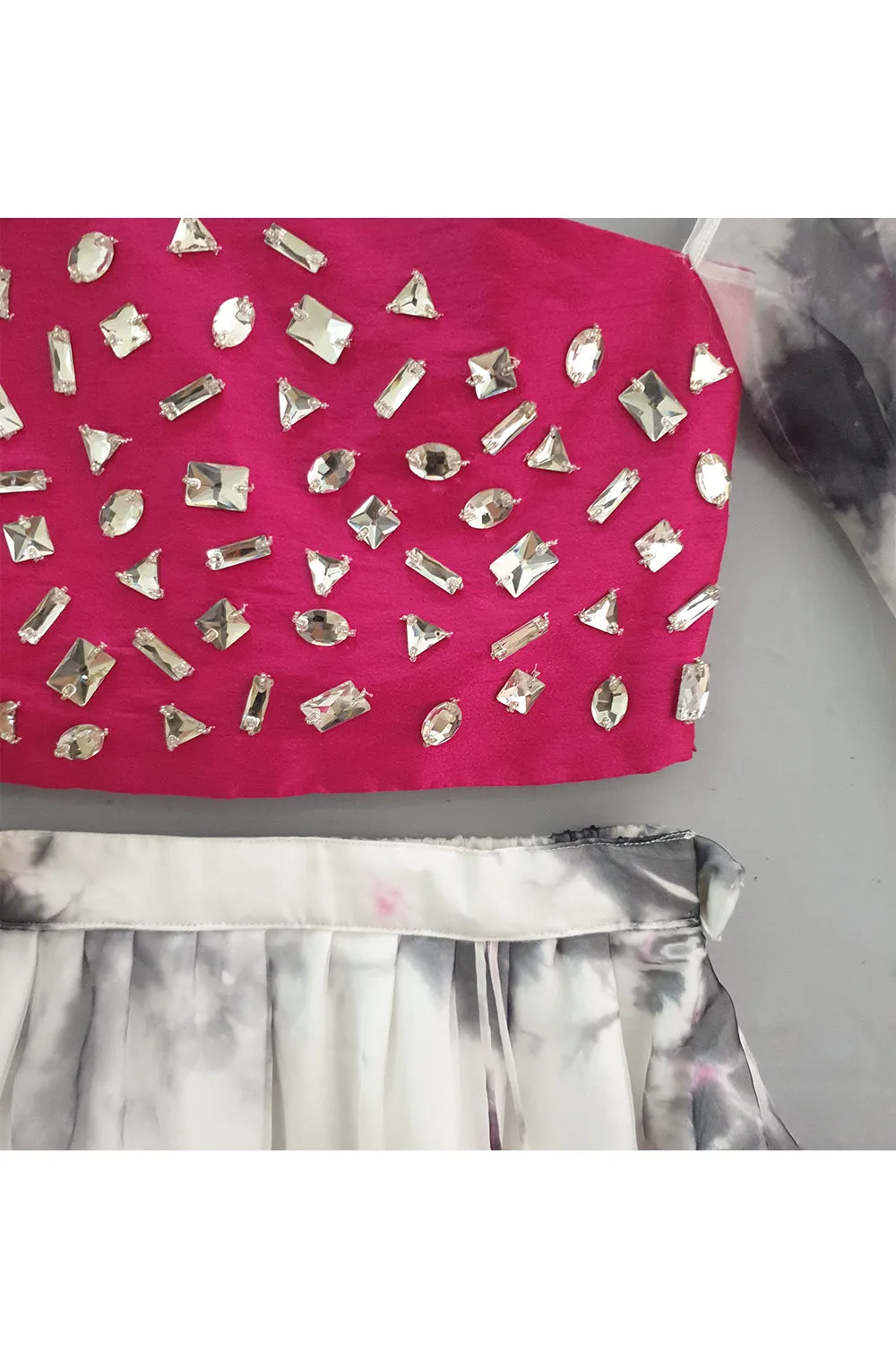 Hot pink one cold shoulder stone studded top with asymmetrical skirt